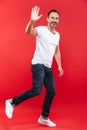 Happy adult man walking isolated waving. Royalty Free Stock Photo