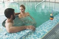 Picture of happy couple relaxing in pool Royalty Free Stock Photo