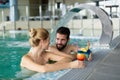 Picture of happy couple relaxing in pool Royalty Free Stock Photo