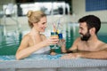 Picture of happy couple relaxing in pool Royalty Free Stock Photo