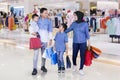 Happy family carries shopping bags in the mall Royalty Free Stock Photo