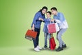 Happy little boy shopping with his parents Royalty Free Stock Photo