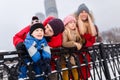 Picture of happy parents with daughter and son on winter walk