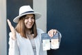 A picture of a happy pretty woman with a wallet with euro banknotes. The concept of cash payments, savings and salaries Royalty Free Stock Photo