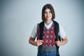 Happy young positive student posing over bright background