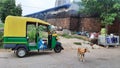 An Auto Rikshaw has been parked on the road.