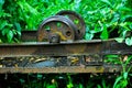 Ancient rusted iron train wheel on the train track. Royalty Free Stock Photo