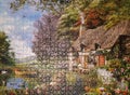 Picture of house in the nature in puzzle with many complicated pieces finished as fun game Royalty Free Stock Photo