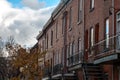 Facades of traditional North American residential buildings, red brick houses, taken in the center of Montreal