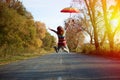 Picture of jumping lady holding umbrella with arms Royalty Free Stock Photo