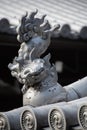 A picture of a karajishi Chinese lion ornament placed on the roof, said to deflect evil and disaster. Royalty Free Stock Photo