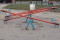 Close up on an empty children see saw, or teeter totter in a playground, with nobody. This type of swing is used by kids for enjoy Royalty Free Stock Photo