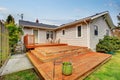 Picture of Large wooden back deck with two chairs. Royalty Free Stock Photo