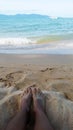 Picture from legacy phone, woman feet, sea and boat in background Royalty Free Stock Photo