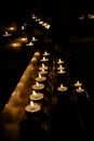 Different Candles in the dark. path of candles path of light Royalty Free Stock Photo