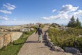 Little girl walking on a stone path on a mountain Royalty Free Stock Photo