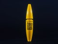 PARIS, FRANCE - APRIL 23, 2023: Logo of Maybelline New York on a Maybelline Colossal mascara tube isolated on black background.