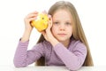 Picture of lovely small girl with piggy bank