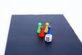 Picture of ludo tokens and dice on the board game