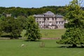 Picture of a lush, green grassy field with the grand Kedleston Hall in the background