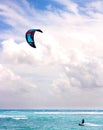 Young man kitesurfing in the blue waters of the caribbean sea Royalty Free Stock Photo