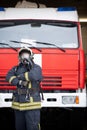 Picture of man fireman in gas mask near fire truck Royalty Free Stock Photo