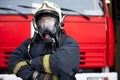 Picture of man fireman in gas mask near fire truck Royalty Free Stock Photo