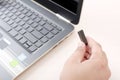 Picture of man holding pen device in hand with laptop on table Royalty Free Stock Photo