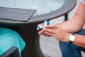 Picture of man putting engagement silver ring on woman hand, outdoor. Royalty Free Stock Photo