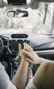 Picture of man and woman in a car. Married couple holding hands, ceremony wedding day. Newly wed couple& x27;s hands with Royalty Free Stock Photo