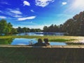 A couple relaxing at the lily pond in Prospect Park Brooklyn