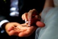 picture of man and woman with wedding ring. Bridal rings in man& x27;s hand. Hands closeup. Royalty Free Stock Photo