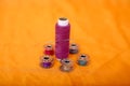 Picture of many bobbin, thread and needle