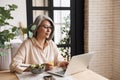 Concentrated business woman using laptop computer