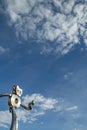 Metal robot running in front of a blue sky