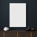 Picture mockup with white vertical frame on dark blue wall. Stylish dark interior with decor and wooden cupboard and blanket pictu Royalty Free Stock Photo