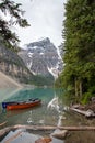A picture of Moraine lake and ten peaks with boats.