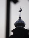 A picture of top of a mosque with the name Allah on it.