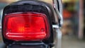 Picture of motorcycle red tail light. Stylish back light of a two wheeler Royalty Free Stock Photo