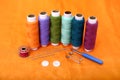 Picture of multicolored sewing thread, needle, bobbin, button, safety pin and needle ripper Royalty Free Stock Photo