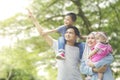 Muslim family looking at something in the park Royalty Free Stock Photo