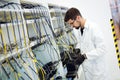 Picture of network technician testing modems in factory Royalty Free Stock Photo