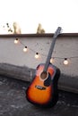 Picture of nice accoustic guitar on rooftop