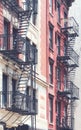 Picture of old buildings with fire escapes, color toning applied, New York City, USA Royalty Free Stock Photo