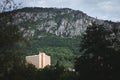 Panorama of the mountains in Baile Herculane with a focus on a high rise tower, socialist architecture. Baile Herculane is a Royalty Free Stock Photo