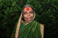 Picture of old Indian grandmother wearing traditional cloths and posing for photo