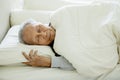 Old man sleeping well on the bed Royalty Free Stock Photo