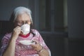 Old woman drinking a cup of hot tea Royalty Free Stock Photo