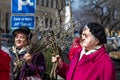 SOMBOR, SERBIA - MARCH 20, 2016: Selective blur on an old woman holding a brand for Catholic Palm sunday in Sombor, Serbia, during