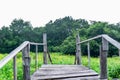 Picture of an old wooden bridge with a beautiful starburst garden background